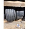 Image 1 : Two tires 12.5 L – 15 SL and Titan 11 L – 16 Titan