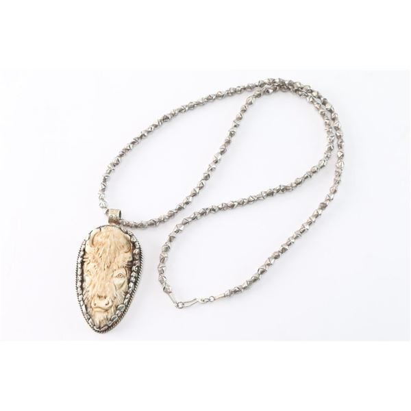 Carved Bone Buffalo Pendant.