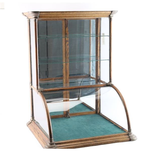 Antique Bow Front Showcase.