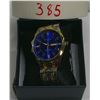 Image 1 : regular numbered watch blue background