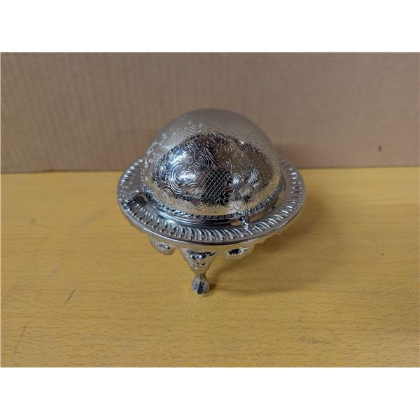 Silver colored candy dish with rotating top