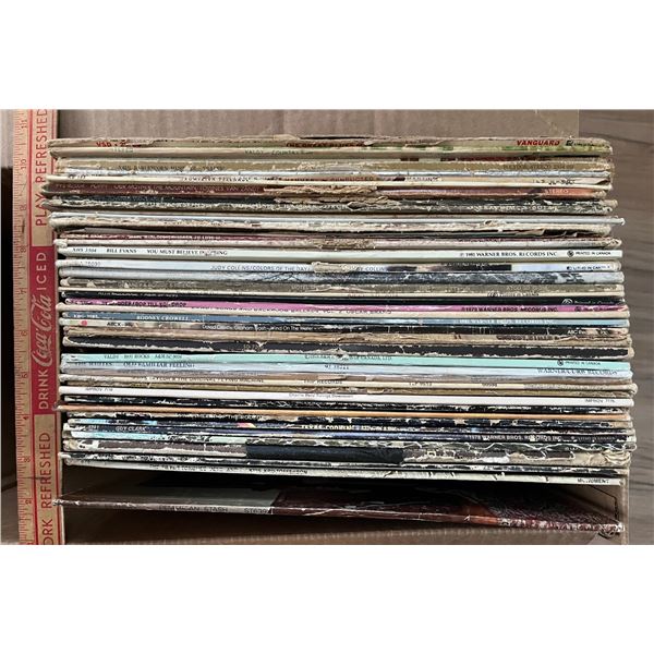 Box of 45ish vinyl record albums. Mostly 1970s. Used condition. Guitar based music.
