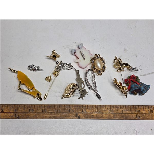 lot of pins and brooches