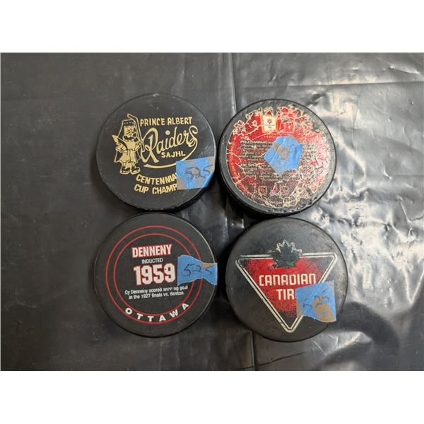 4 Assorted Hockey Pucks