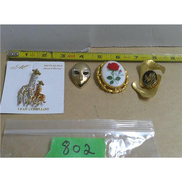 (4) brooches, giraffe, mask, flower design