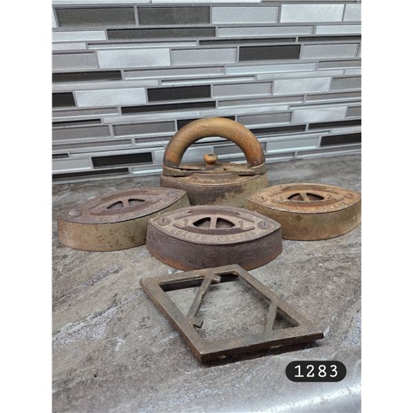 Antique Cast Iron Set of (4) Irons w/ Detachable Wooden Handle and Base.