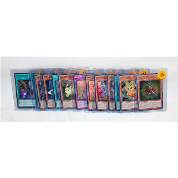 LOT OF 13 YU-GI-OH! CARDS IN TOPLOADERS