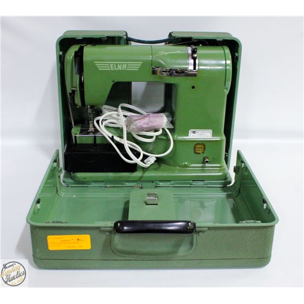 VINTAGE SEWING MACHINE IN GREEN CASE