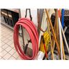 Image 6 : Multiple Cleaning Tools: Hose, Mops, Caution Signs, etc
