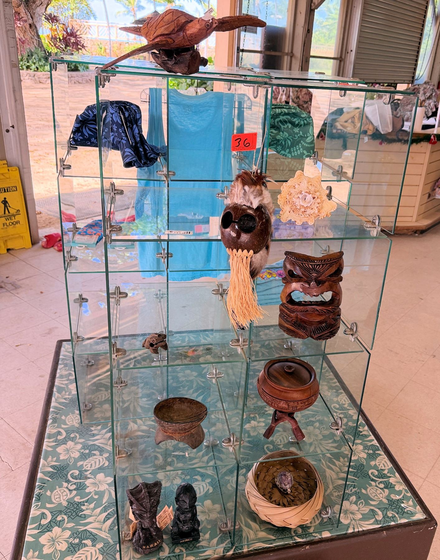 Display A Turtle Shell Contents of Display: Wooden Turtle, Shells, Helmets, Tikis, Bowls, etc ...
