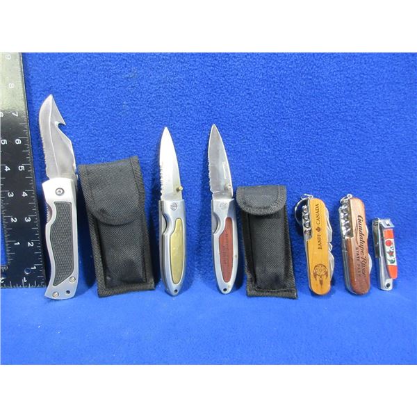 3 Folding Lock Blade Knives, 2 Swiss Style Knives and Nail Clippers