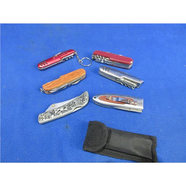 2 Folding Lock Blade Knives and 4 Swiss Style Knives