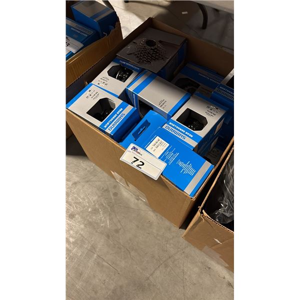 BIN OF MIXED ITEMS OF SHIMANO PARTS INCL REAR DERAILLEURS, CASSETTE SPROCKETS AND MORE
