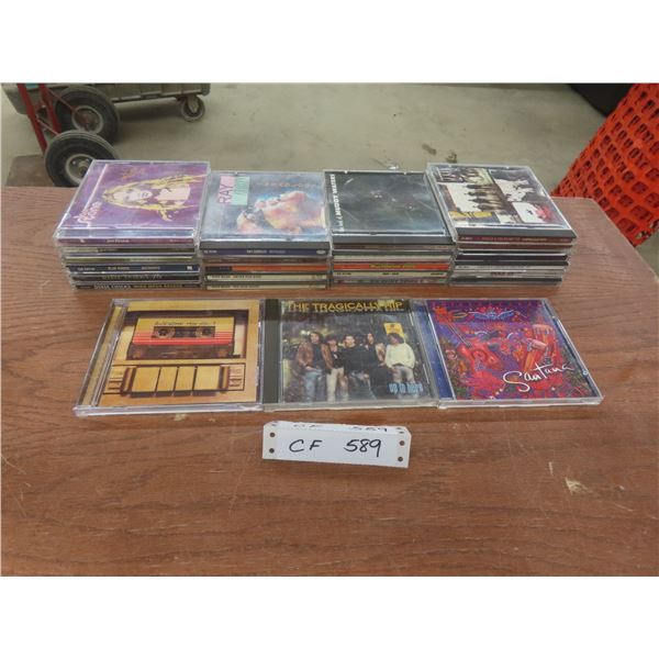 Over 20 CDs Including Santana, The Tragically Hip, Ray Charles, and More