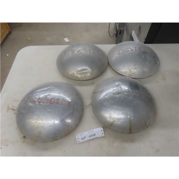 Four Vintage Chevy Hubcaps