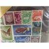 Image 4 : Stamp Collection Including Foreign and Canadian Stamps, Players Cigarette Tin, and Vintage Nabob Co