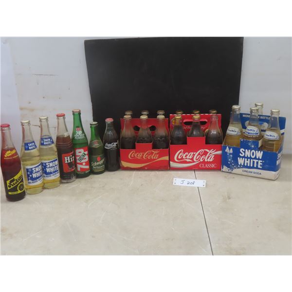 22 Soda Bottles With Product And 3 Cardboard Cartons: Snow White, Nesbitt's, Hires, Schweppes, Coca