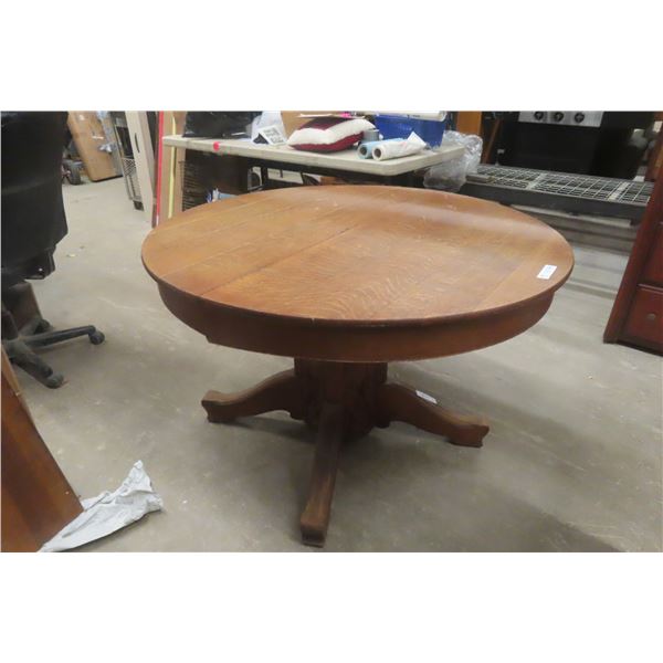 Oak Pedestal Table 28" x 44" Diameter With Two 9" Leaves