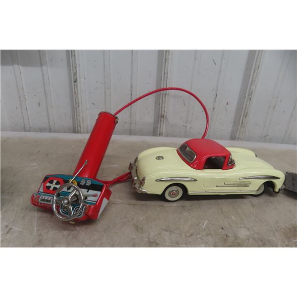 T.N. Japan Nomura Benz Tin Battery Operated Wired Remote Control Car, 1950s, 11" Long, With Extra C
