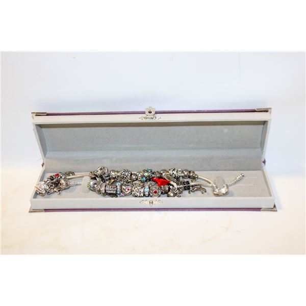 2 CHARM BRACELETS WITH 30 CHARMS