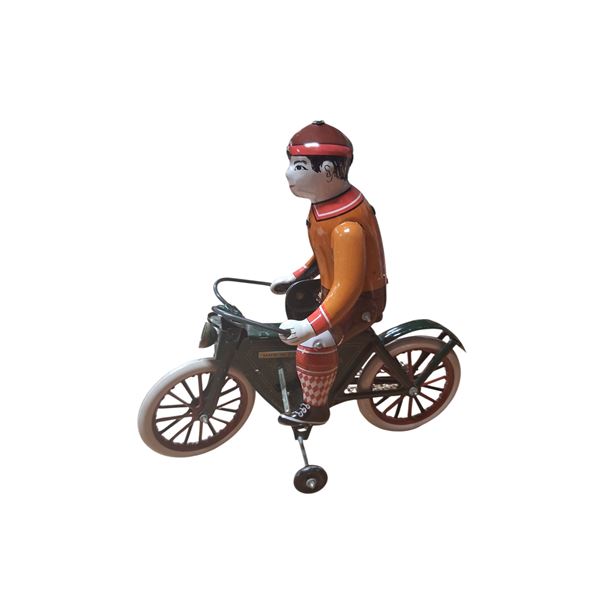 Tin toy man on bicycle 7.5"