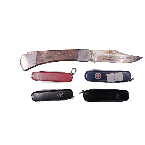 4 Swiss Army knives plus one buck knife