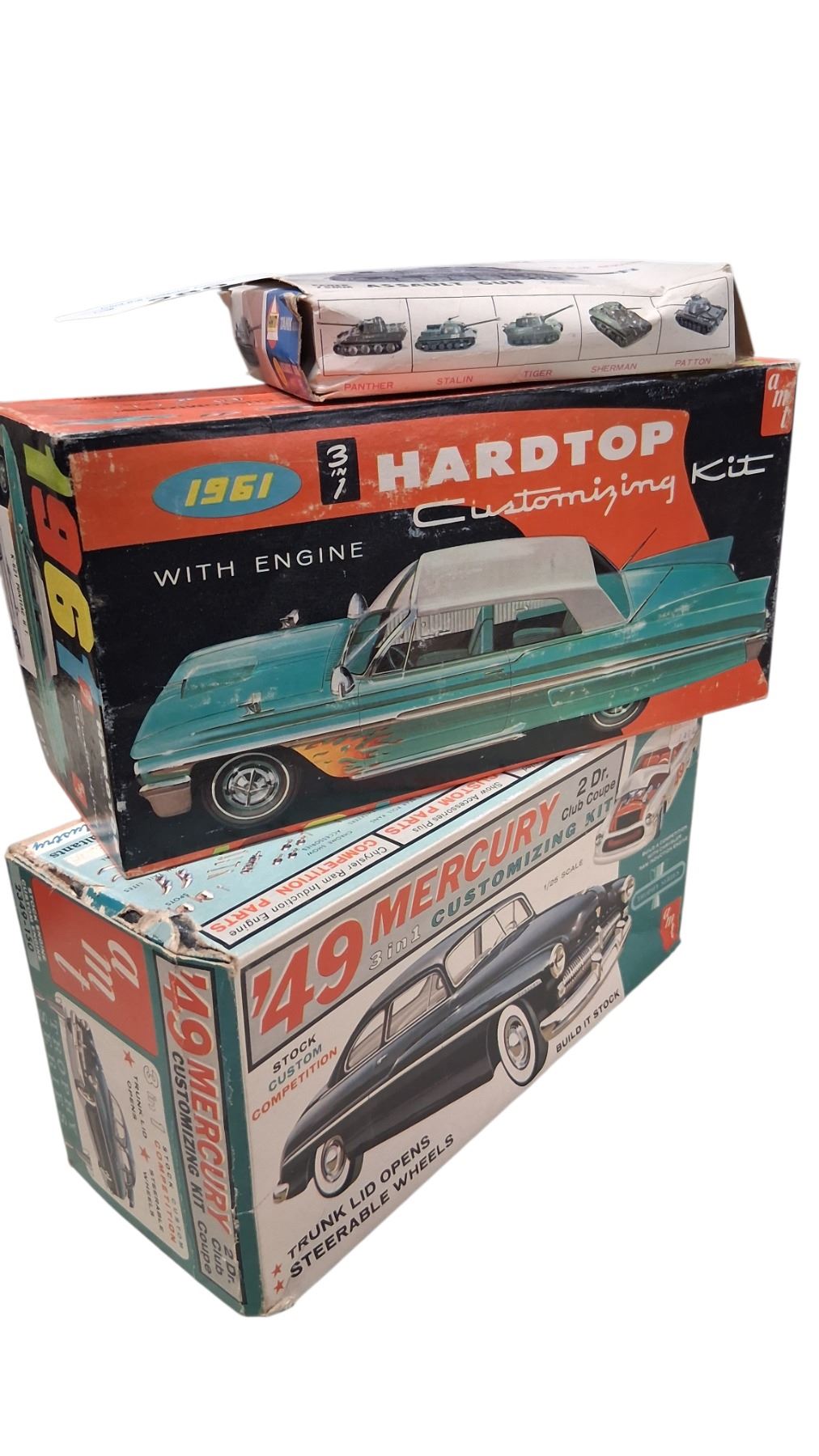 2 vintage model boxes with various pieces plus vintage tank model