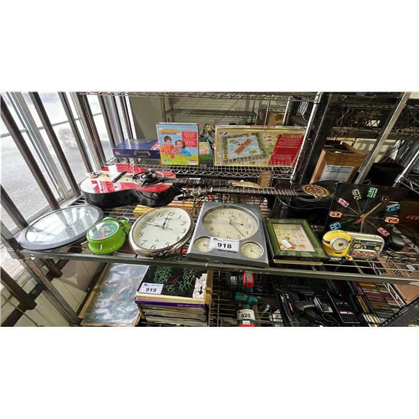 SHELF LOT OF ASSORTED CLOCKS AND (2)GUITARS