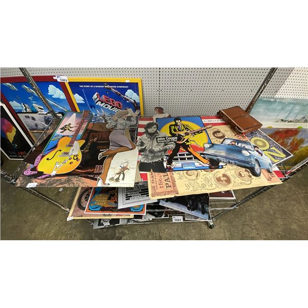 SHELF OF ASSORTED VINTAGE MUSIC AND MOVIE POSTERS