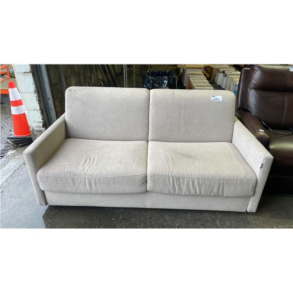 CREAM FABRIC UPHOLSTERED LOVE SEAT/SOFA BED - *NEEDS A LIGHT CLEANING*