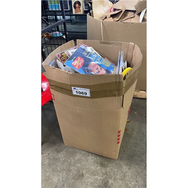 A BOX OF ASSORTED ITEMS INCLUDING MAGAZINES, CD'S, DVD'S AND MORE