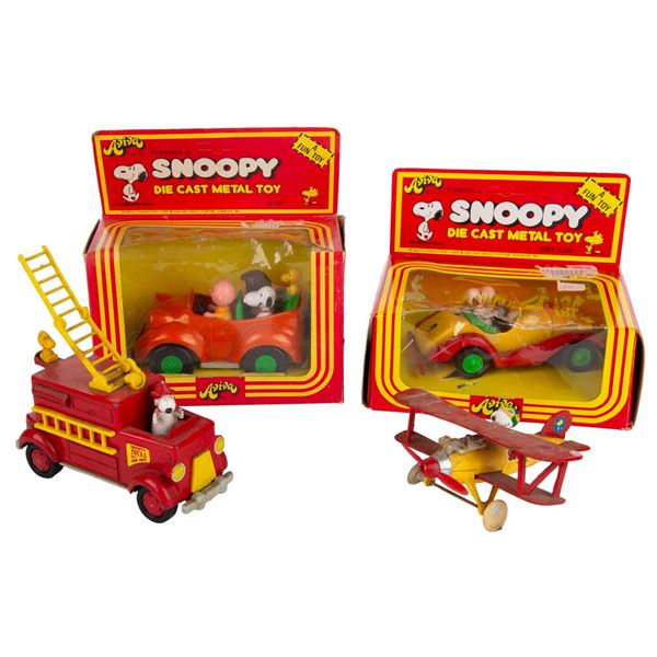 A Set of 4 Snoopy Die-Cast Metal Toy Vehicles.