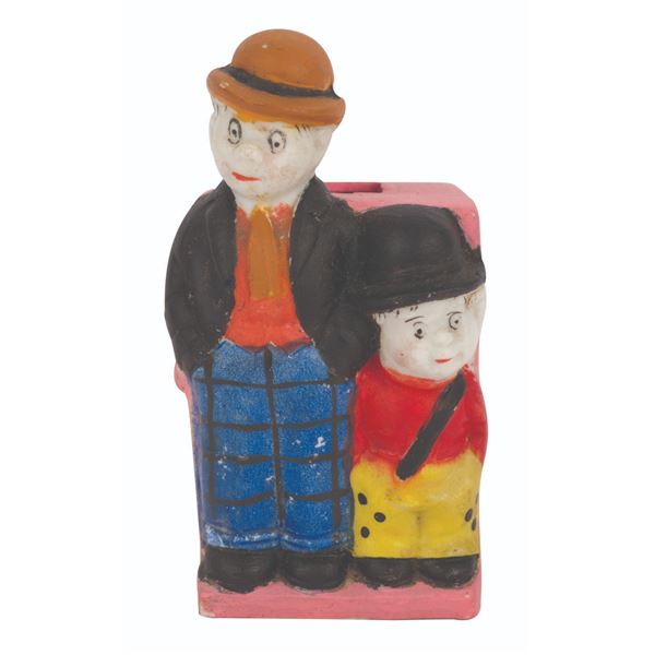 A Moon Mullins & Kayo Bisque Toothbrush Holder.