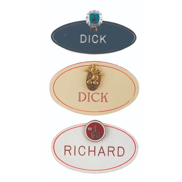 A Trio of Disneyland Cast Member Name Badges with Rare Service Pins.