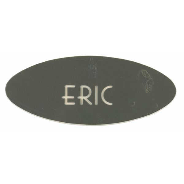 An "Eric" Cast Member Name Badge.