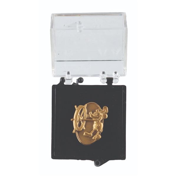 A Disneyland Cast Member One Year Service Pin.