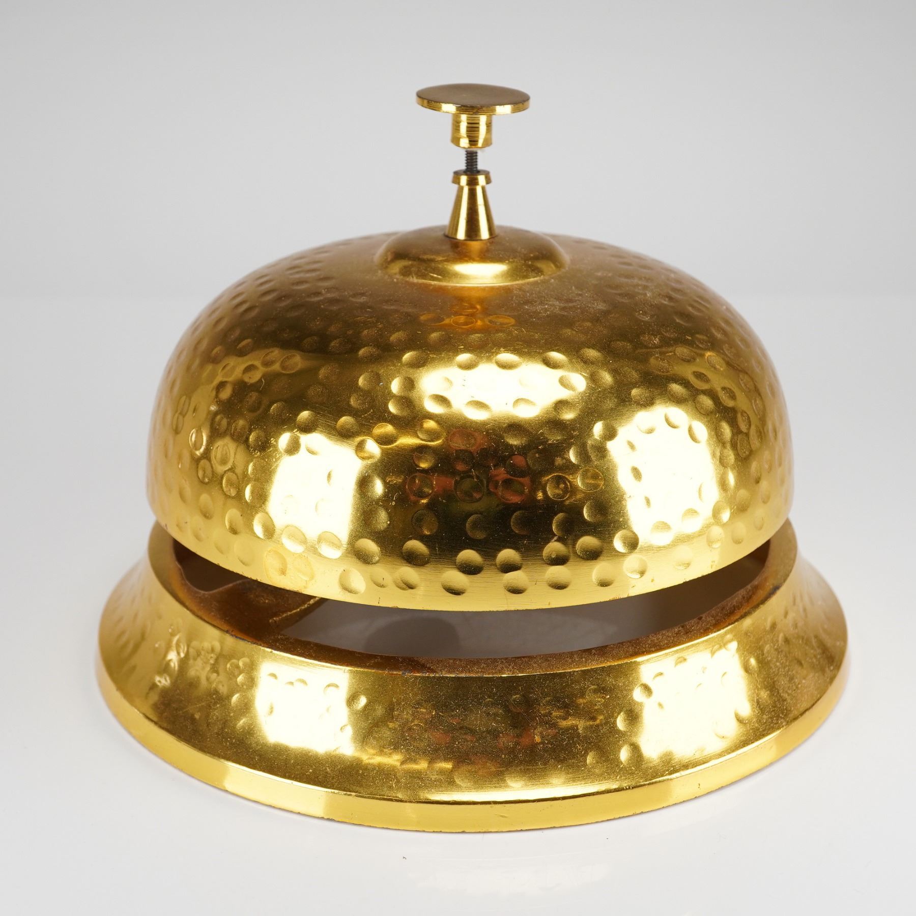 A Large Brass-Toned Counter Service Bell with Hammered Finish