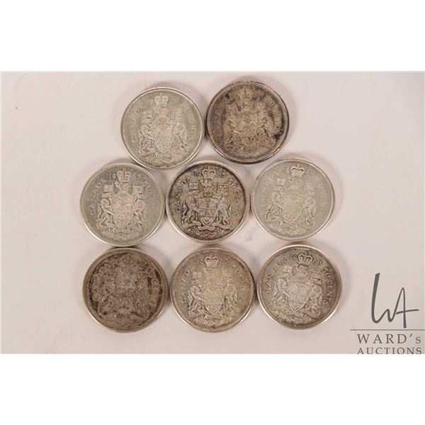 Eight Canadian 50 cent coins including 1960, 1962, three 1963, 1964, 1965, and 1966