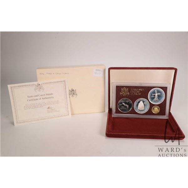 1976 Royal Canadian Mint  Turks and Caicos Islands  four coin set in silver and gold plus presentati