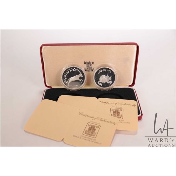 1976 Royal Mint two coin collector sets inlcuding "Sultan of Oman", 2 5 omani rials and 5 omani rail
