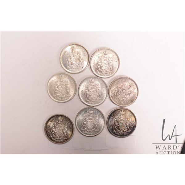 Eight Canadian silver fifty cent pieces including 7 X 1965 and 1966