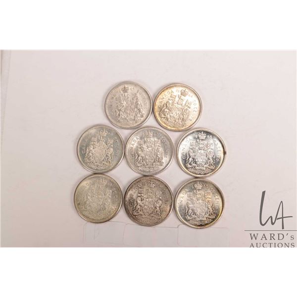 Eight Canadian silver fifty cent pieces including 1960, 5 X 1964 and 2 X 1965