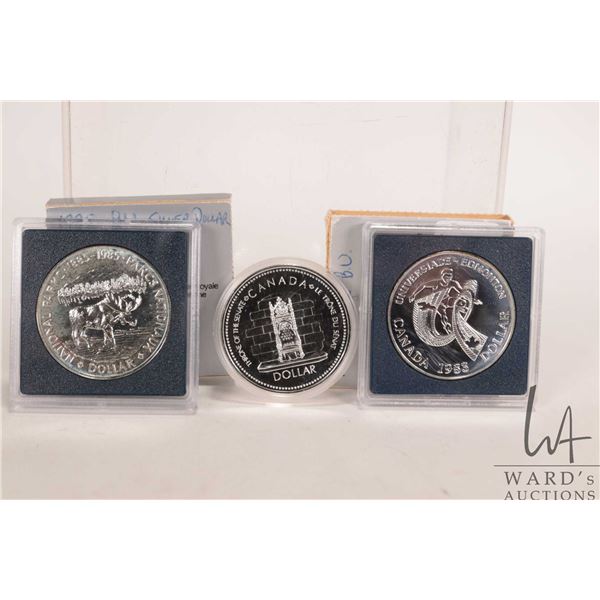 Three Canadian one dollar coins with silver content including 1977 "Throne of the Senate", 1985 "Nat