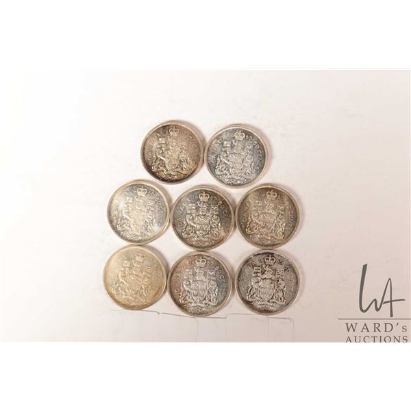 Eight Canadian fifty cent coins, all 1965