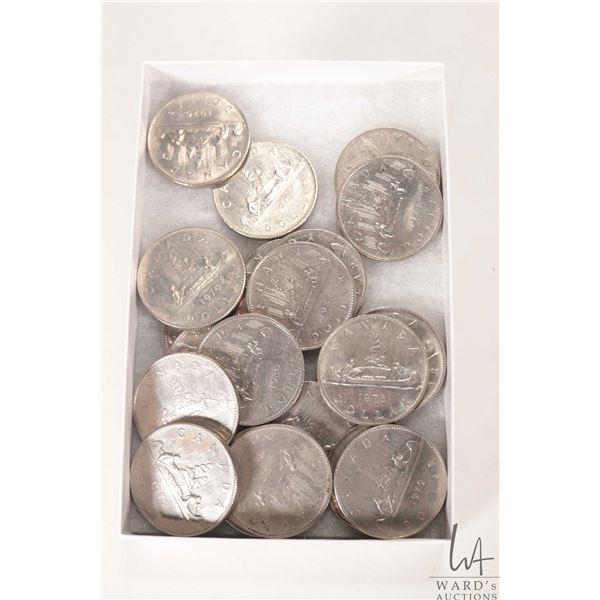 Twenty three Canadian one dollar coins from the 1980's and 1980's