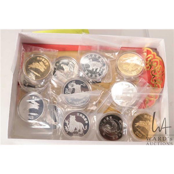 Twelve RBC Chinese Zodiac Numismatic tokens including 2017 Rooster X 3, 2019 Pig, 2021 Bull, 2022 Ti