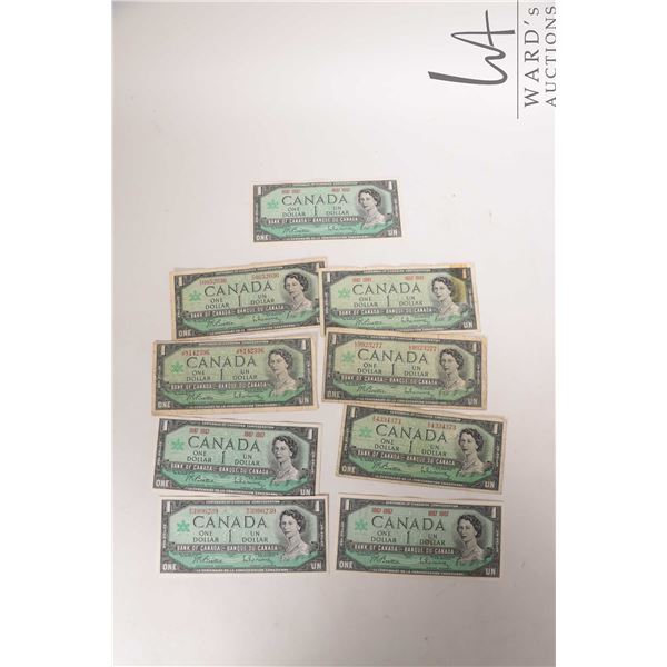 Nine 1967 Bank of Canada $1 bills in circulated to heavily circulated condition