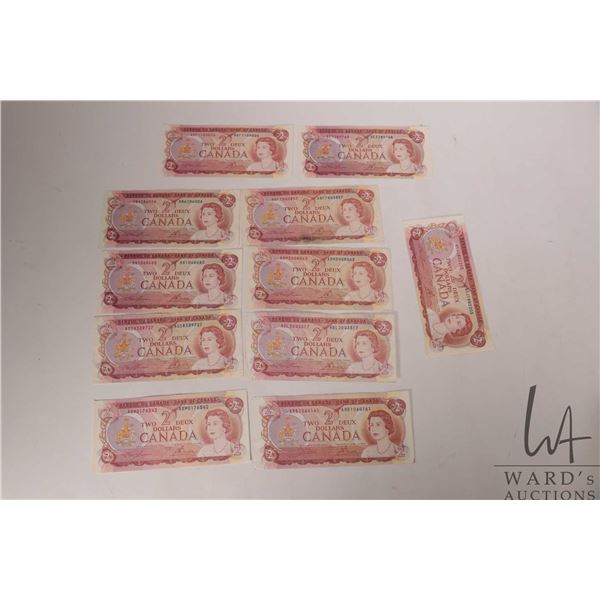 Eleven 1974 Bank of Canada $2 bills in circulated condition
