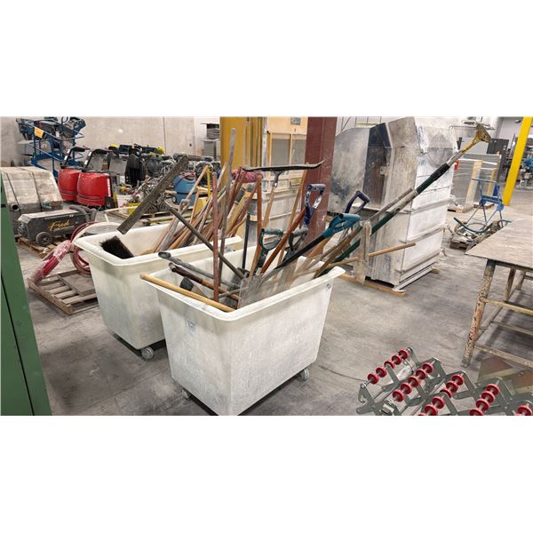 WHITE PLASTIC MOBILE BIN FILLED WITH ASSORTED BROOMS, SHOVELS. ETC