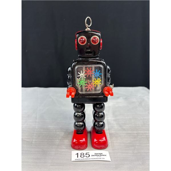 Vintage Ha Ha Toy Robot Black High Wheel Wind Up Tin Robot